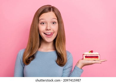 Portrait Of Attractive Cheery Funny Brown-haired Girl Holding Pie Licking Lip Isolated Over Pink Pastel Color Background