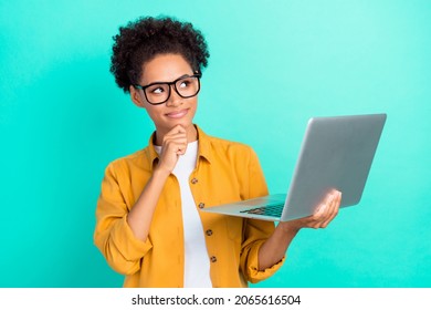 Portrait Of Attractive Cheery Minded Girl Thinking Using Laptop Isolated Over Bright Teal Turquoise Color Background