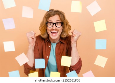 Portrait Of Attractive Cheery Red-haired Guy Memo Wall Celebrating Solution Isolated Over Beige Pastel Color Background