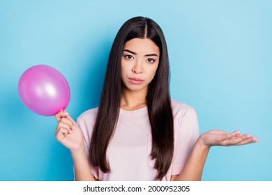 Portrait Of Attractive Clueless Girl Holding Air Ball No Idea Prepare Isolated Over Bright Blue Color Background