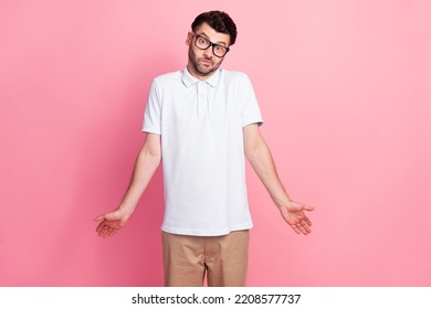 Portrait Of Attractive Clueless Guy Dressed Fashionable Clothes Shrugging Shoulders Isolated On Pink Color Background