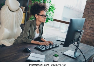 Portrait Of Attractive Concentrated Skilled Successful Girl Writing Email Preparing Presentation At Workplace Workstation Indoors