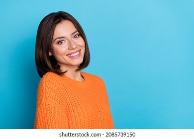 Portrait of attractive confident cheerful girl copy empty blank space isolated over bright blue color background