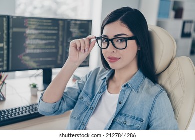 Portrait of attractive content skilled girl expert ceo boss chief web designer touching specs at work place station indoors