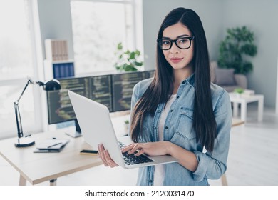 Portrait Of Attractive Content Skilled Intellectual Girl Technician Expert Web Designer Holding Using Laptop At Workplace Workstation Indoors