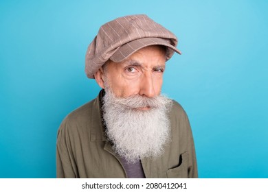 Portrait of attractive curious funny grey-haired man mister looking at you suspect isolated over vibrant blue color background