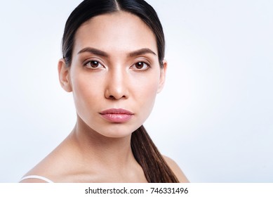 Portrait Of Attractive Dark-haired Woman With Pony Tail