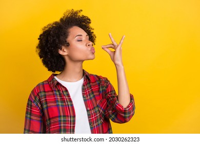 Portrait of attractive dreamy cheerful girl tasting invisible meal dish isolated over bright yellow color background - Shutterstock ID 2030262323