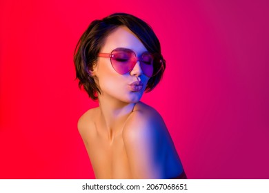 Portrait Of Attractive Dreamy Funky Girl Wearing Specs Sending Air Kiss Isolated Over Bright Red Multicolor Color Background