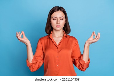 Portrait Of Attractive Focused Healthy Girl Meditating Retreat Isolated Over Vibrant Blue Color Background