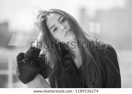 Similar – Woman looking from her balcony the city