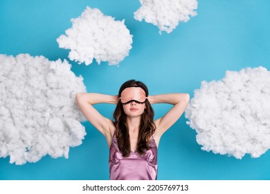 Portrait of attractive girl relaxing sleeping fluffy clouds flying isolated over bright blue color background - Shutterstock ID 2205769713