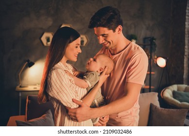 Portrait Of Attractive Idyllic Cheerful Family Parenthood Cuddling Toddler Late Night At Home House Flat Indoors