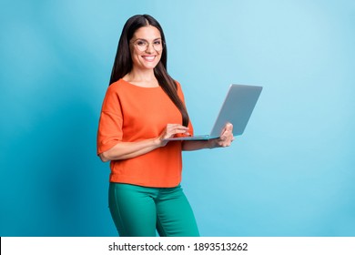 Portrait Of Attractive Lady Arms Hold Computer Eyewear Toothy Smile Isolated On Blue Color Background