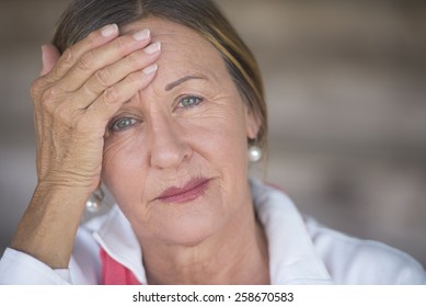 Portrait Attractive Mature Woman With Headache, Painful Migraine, Stressful Menopause, Blurred Background, Copy Space.