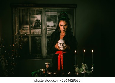 Portrait of an attractive mature woman holding skull ready for Day Of The Dead. - Powered by Shutterstock