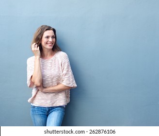 Portrait Of An Attractive Mid Adult Woman Smiling With Hand In Hair