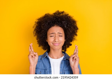 Portrait Of Attractive Nervous Teen Age Girl Crossed Fingers Praying Wait Expect Isolated Over Bright Yellow Color Background