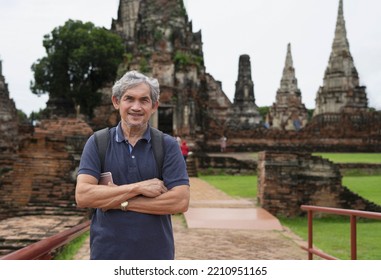 Portrait Attractive Older Adult Tourist Visited Ayutthaya Historical Park,Thailand. Concept Elderly People Lifestyle,cultural Heritage Tourism, Ecotourism,pensioner Quality Of Life,cultural Heritage