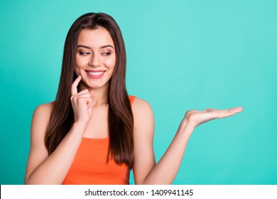 Portrait Attractive Pretty Person Promotion Attention Thoughtful Thoughts Dream Option Inspired Positive Cheerful Satisfied Content Fashionable Spring Orange Long Outfit Isolated Teal Background