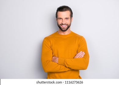 Portrait of attractive self-assured with beaming shiny smile haircut with long furfur wearing casual classic color of mustard sweater macho man standing with folded arms isolated on gray background - Shutterstock ID 1116273626