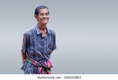 Portrait Of Attractive Senior Asian Man Smiling And Looking At Camera In Studio With White Isolated Background Feeling Positive Grandpa.  Father Concept.