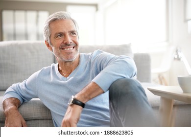 Portrait Of Attractive Senior Man With Blue Sweater Relaxing At Home