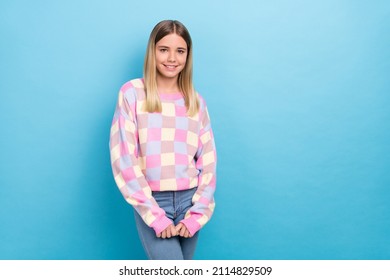 Portrait of attractive shy modest cheerful girl posing copy space isolated over vibrant blue color background