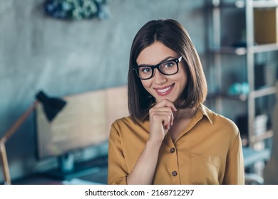 Portrait Of Attractive Skilled Cheerful Girl Nerd Geek Touching Chin Tech Network Workshop At Workplace Workstation Indoors