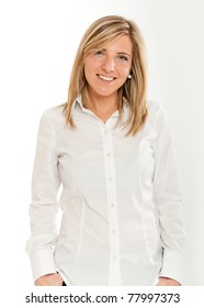  Portrait of an attractive smiling blonde woman in white shirt