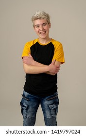 Portrait Of Attractive Stylish Fashion Teenager Confident And Happy With His Gender Identity. Trans Boy Posing In Cool Urban Fashion T Shirt. In Beauty, Transgender People And Equality Concept.