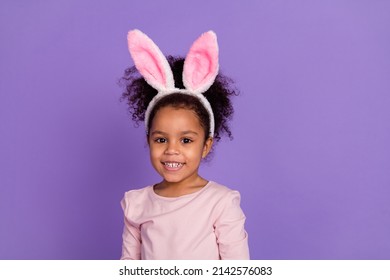 Portrait of attractive trendy cheerful cute sweet pre-teen girl wear bunny ears isolated over bright purple violet color background - Powered by Shutterstock