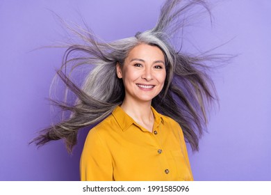 Portrait Of Attractive Trendy Cheerful Woman Throwing Shine Hair Isolated Over Bright Violet Purple Color Background