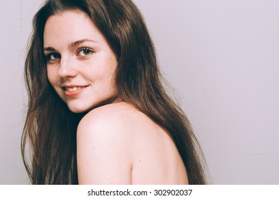 Portrait  Attractive Woman With Freckles Clear Skin And Beautiful Hair