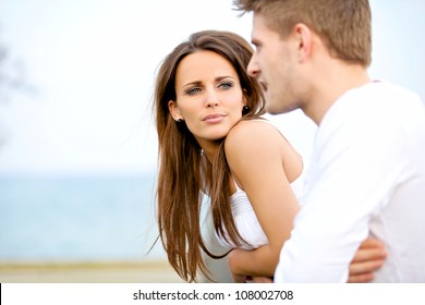 Portrait of an attractive woman seriously listening to her boyfriend while on a date