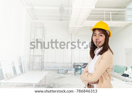Portrait of  Attractive Women Wearing yellow helmet . Standing confidently at the Construction site, beautiful woman civil engineer portrait in front of construction site. concept of workingwomen