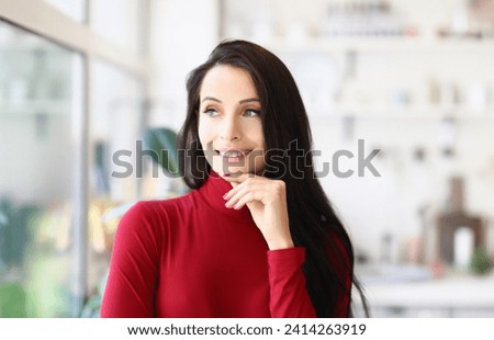 Portrait of attractive young lady with brunette haircut posing with pensive look. Woman dreaming about future, building plans. Beauty, dream, idea concept
