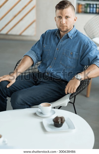 Portrait of attractive\
young man in cafe