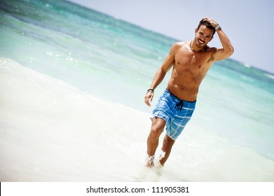 Portrait Of An Attractive Young Man On A Tropical Beach