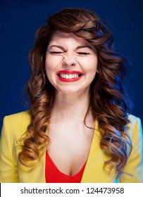 Portrait Of An Attractive Young Woman Laughing Hard