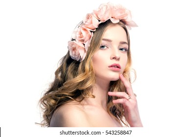 Portrait Of Attractive Young Woman With Pink Flower Wreath On Head Looking At Camera.Isolated.