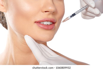 Portrait of an attractive young woman receiving botox treatment.