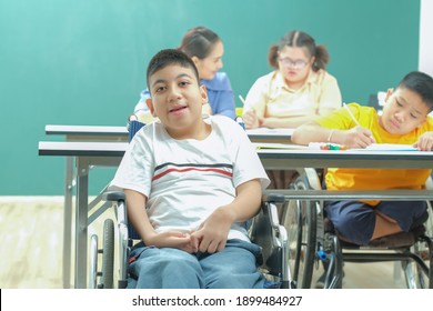 Portrait of Autism student kids ,  cute smile kids in wheelchair at school for special needs