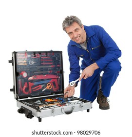 Portrait of automechanic taking a wrench out of toolbox. Isolated on white - Powered by Shutterstock