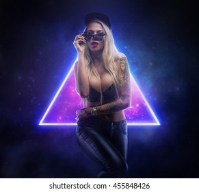 Portrait of awesome blond tattooed female over neonic hipster symbol.