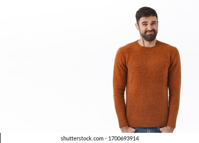 Portrait of awkward and uncomfortable caucasian bearded man, smirk and grimacing, cringe unwilling do something, standing reluctant and embarrassed, standing awkward white background
