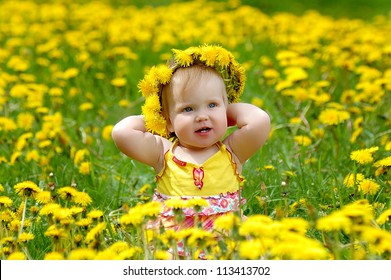 Portrait Of A Baby In A Dandelion Wreath