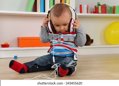 Portrait Of A Baby Listening To Music With Headphones