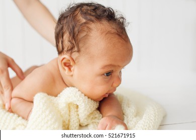 Portrait Of Baby Lying On Woolen Blanket Holding Head Up. Newborn Children Development, Innocence, Happy Family, New Life, Baby Massage Concept