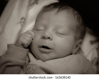 portrait of a baby sleeping peacefully